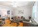 Bright living room with hardwood floors, neutral walls, and comfortable seating arrangement at 6128 Coatbridge Ln, Charlotte, NC 28212