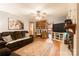 Spacious living room showcasing a fireplace, hardwood floors, built-in shelves, and comfortable sofa seating at 6128 Coatbridge Ln, Charlotte, NC 28212