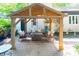 Inviting covered patio with comfortable seating around a cozy fire pit, perfect for outdoor relaxation at 6128 Coatbridge Ln, Charlotte, NC 28212