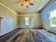 Well-lit bedroom boasting wood floors, neutral paint, and a decorative fireplace at 614 E Main Ave, Taylorsville, NC 28681