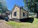 Charming exterior of a home with neutral siding, black trim, and well-maintained landscaping at 614 E Main Ave, Taylorsville, NC 28681