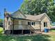 Exterior view of a home with a deck, stairs, and a well-maintained backyard at 614 E Main Ave, Taylorsville, NC 28681