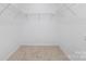 Walk-in closet with carpet and wire shelving offers ample storage at 627 West Main Ext, Lincolnton, NC 28092