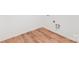 Bright laundry area with new wood-look flooring and white walls, awaiting your customization at 627 West Main Ext, Lincolnton, NC 28092