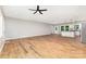 Open concept living area with hardwood floors, fan and natural lighting at 627 West Main Ext, Lincolnton, NC 28092