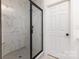 Bathroom boasts a tiled shower with a sleek black frame and modern fixtures at 627 West Main Ext, Lincolnton, NC 28092