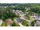 Expansive aerial view of a beautiful neighborhood with mature trees and well-maintained homes and green lawns at 708 Ardent Trl, Belmont, NC 28012