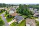 Aerial view showcases the home's beautifully landscaped yard and manicured lawn in a desirable neighborhood at 708 Ardent Trl, Belmont, NC 28012