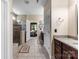 Bathroom view including a shower, double sinks, and access to the main bedroom at 708 Ardent Trl, Belmont, NC 28012