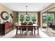 Dining area features a sliding door, tile floors, and views of the backyard at 708 Ardent Trl, Belmont, NC 28012