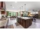 Open kitchen with an island, breakfast bar, and seamless transition to the living area at 708 Ardent Trl, Belmont, NC 28012