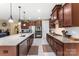 Updated kitchen with stainless steel appliances, an island, and plenty of storage at 708 Ardent Trl, Belmont, NC 28012