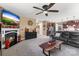 Open-concept living room includes a fireplace, tv, and access to the kitchen at 708 Ardent Trl, Belmont, NC 28012