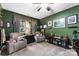 Comfortable living room showcasing plush recliners, window with natural light, and green walls at 708 Ardent Trl, Belmont, NC 28012
