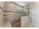 Tiled shower with glass enclosure, built-in bench, and a showerhead at 708 Ardent Trl, Belmont, NC 28012
