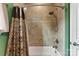 Updated bathroom shower with tile surround, rainfall shower head, and modern fixtures at 708 Ardent Trl, Belmont, NC 28012