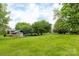 Expansive grassy area with view of pool house at 712 Mallard Head Ln, Mooresville, NC 28117