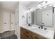 Stylish bathroom featuring a dual sink vanity with quartz countertop and matte black fixtures at 712 Mallard Head Ln, Mooresville, NC 28117