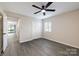 Spacious bedroom with wood-look floors and large closet at 712 Mallard Head Ln, Mooresville, NC 28117