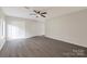 Spacious bedroom featuring new flooring, ceiling fan and closet for storage at 712 Mallard Head Ln, Mooresville, NC 28117