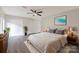 Comfortable bedroom with plush rug, ceiling fan, and a decorative plant bringing life to the space at 712 Mallard Head Ln, Mooresville, NC 28117