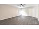Bright, spacious bedroom with neutral paint, modern flooring, closet, and large window at 712 Mallard Head Ln, Mooresville, NC 28117