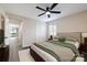 Comfortable bedroom features a ceiling fan, carpet, and closet at 712 Mallard Head Ln, Mooresville, NC 28117