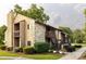 Condo exterior view shows wood siding, stone accents, exterior staircases, and landscaping at 712 Mallard Head Ln, Mooresville, NC 28117
