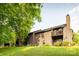 Exterior building with well maintained lawn and mature tree at 712 Mallard Head Ln, Mooresville, NC 28117