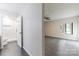 Hallway view to renovated bathroom and bedroom with ample natural light and stylish flooring at 712 Mallard Head Ln, Mooresville, NC 28117