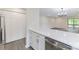 Kitchen view showing modern cabinets with gold pulls, stainless appliances, and stone countertops at 712 Mallard Head Ln, Mooresville, NC 28117