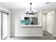 Open-concept kitchen view showcasing modern appliances, white cabinets, and turquoise backsplash at 712 Mallard Head Ln, Mooresville, NC 28117