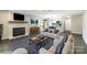 Living room view with a fireplace, mantel, and an open doorway to the kitchen at 712 Mallard Head Ln, Mooresville, NC 28117