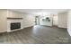 Spacious living room with fireplace and view of the open kitchen at 712 Mallard Head Ln, Mooresville, NC 28117