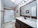 Clean bathroom featuring a shower, vanity, and ceramic tile flooring at 727 Cove Rd, Gastonia, NC 28052