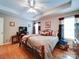 Inviting bedroom with hardwood floors, a ceiling fan, and natural light at 727 Cove Rd, Gastonia, NC 28052