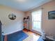Bright exercise room with hardwood floors and a window at 727 Cove Rd, Gastonia, NC 28052