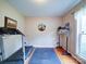 Bright exercise room with hardwood floors and a treadmill at 727 Cove Rd, Gastonia, NC 28052