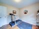 Bright exercise room with hardwood floors and a treadmill at 727 Cove Rd, Gastonia, NC 28052