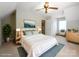 Bedroom with a ceiling fan, and nicely decorated with coordinated furniture and colors at 7521 Surreywood Pl, Charlotte, NC 28270