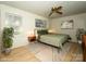 Bedroom features natural light, hardwood floors, and neutral decor at 7521 Surreywood Pl, Charlotte, NC 28270