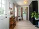 Cozy entryway with natural light, wood floors, and black storage cabinets at 7521 Surreywood Pl, Charlotte, NC 28270