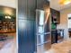 Spacious kitchen with stainless steel refrigerator and modern black cabinetry at 7521 Surreywood Pl, Charlotte, NC 28270