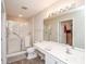 Well-lit bathroom featuring a glass shower, neutral color palette, and sink with full vanity mirror at 8183 Sultana Cir, Charlotte, NC 28227