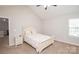 Cozy bedroom with a vaulted ceiling, ceiling fan, carpeted floors, and a neutral color palette at 8183 Sultana Cir, Charlotte, NC 28227