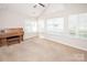 Bonus room bathed in sunlight, featuring large windows and high ceilings, adaptable for many uses at 8183 Sultana Cir, Charlotte, NC 28227