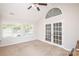 Versatile bonus room with ample windows and French doors, perfect for various activities at 8183 Sultana Cir, Charlotte, NC 28227