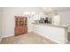 Cozy dining area adjacent to kitchen with built-in china cabinet at 8183 Sultana Cir, Charlotte, NC 28227