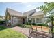 Exterior view of a well-maintained home with an inviting outdoor seating area and manicured greenery at 8183 Sultana Cir, Charlotte, NC 28227