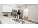 Kitchen with white cabinets, granite counters, and stainless steel appliances at 8183 Sultana Cir, Charlotte, NC 28227